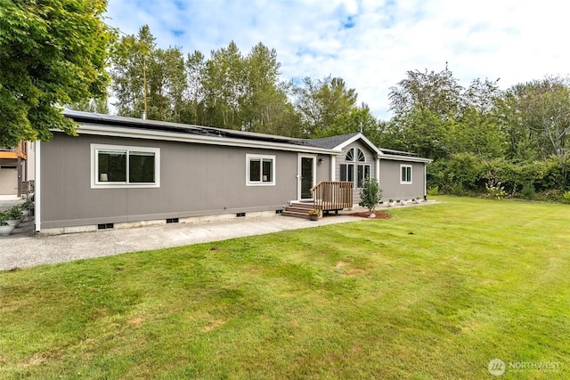 3148 Mountain View Rd, Ferndale, WA 98248 - rear view of house with solar panels, a patio area, crawl space, and a yard