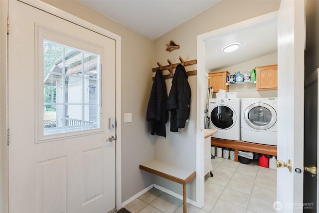 3148 Mountain View Rd, Ferndale, WA 98248 - washroom with cabinet space, washing machine and clothes dryer, and light tile patterned flooring