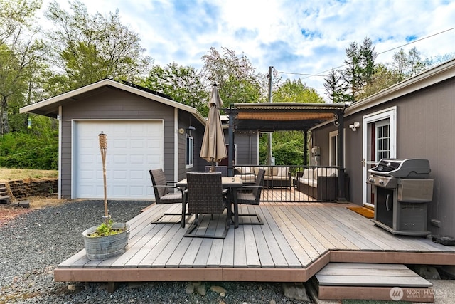 3148 Mountain View Rd, Ferndale, WA 98248 - wooden terrace featuring a grill, outdoor dining space, an outbuilding, and a garage