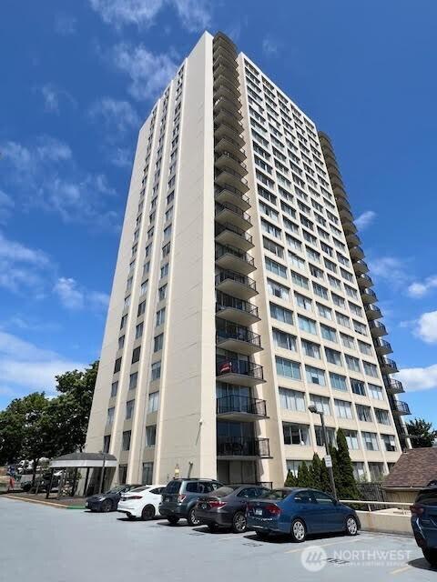 4540 8th Ave NE Unit 903, Seattle, WA 98105 - view of apartment building / complex with uncovered parking