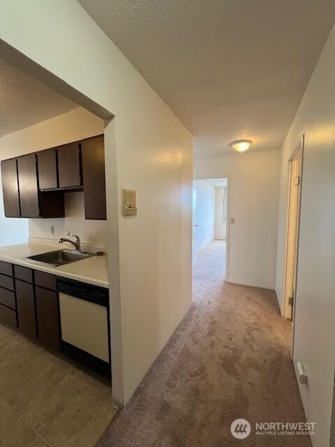 4540 8th Ave NE Unit 903, Seattle, WA 98105 - hallway featuring a textured ceiling and light colored carpet