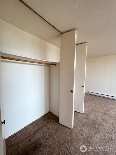 4540 8th Ave NE Unit 903, Seattle, WA 98105 - closet with a baseboard radiator