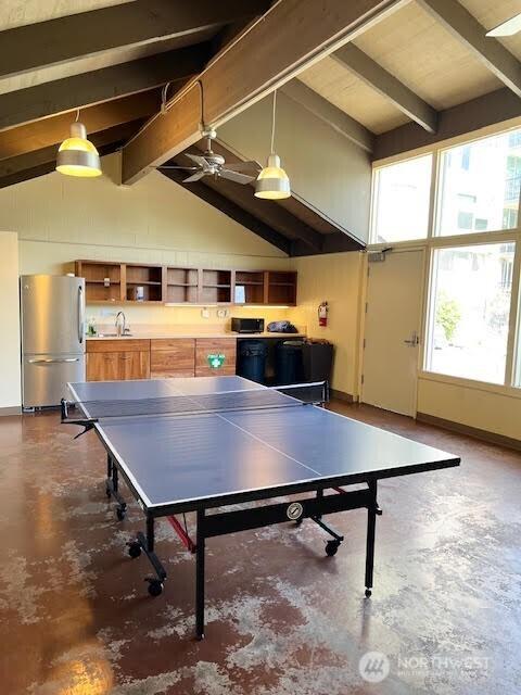 4540 8th Ave NE Unit 903, Seattle, WA 98105 - recreation room featuring concrete floors, beam ceiling, plenty of natural light, high vaulted ceiling, and a ceiling fan