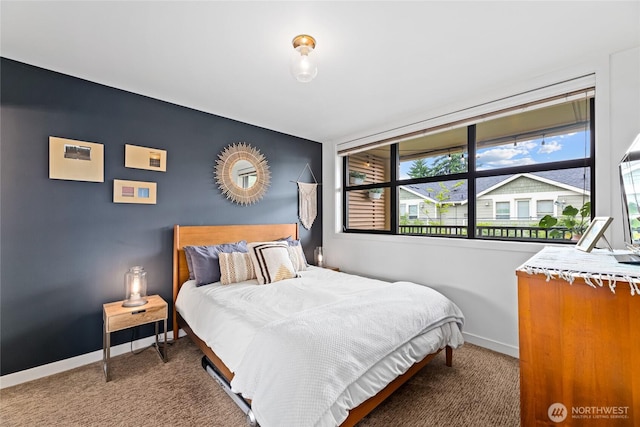 4116 California Ave SW Unit 309, Seattle, WA 98116 - carpeted bedroom featuring baseboards