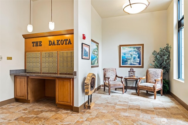 4116 California Ave SW Unit 309, Seattle, WA 98116 - sitting room with light stone finish floors and a towering ceiling