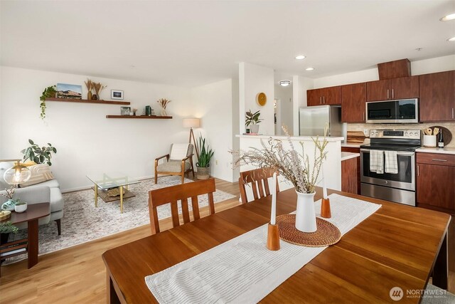 2101 N 55th St Unit 312, Seattle, WA 98103 - dining space with light wood-type flooring and recessed lighting