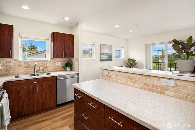 2101 N 55th St Unit 312, Seattle, WA 98103 - kitchen with dishwasher, light wood finished floors, light countertops, tasteful backsplash, and recessed lighting