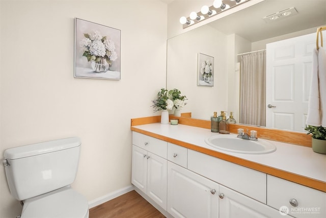 2101 N 55th St Unit 312, Seattle, WA 98103 - bathroom featuring vanity, wood finished floors, and a shower with curtain