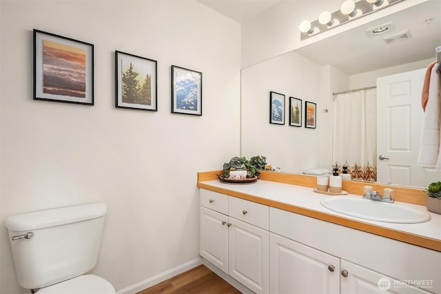 2101 N 55th St Unit 312, Seattle, WA 98103 - bathroom with vanity and wood finished floors