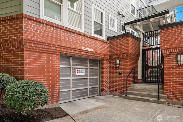 2101 N 55th St Unit 312, Seattle, WA 98103 - property entrance featuring concrete driveway and a garage