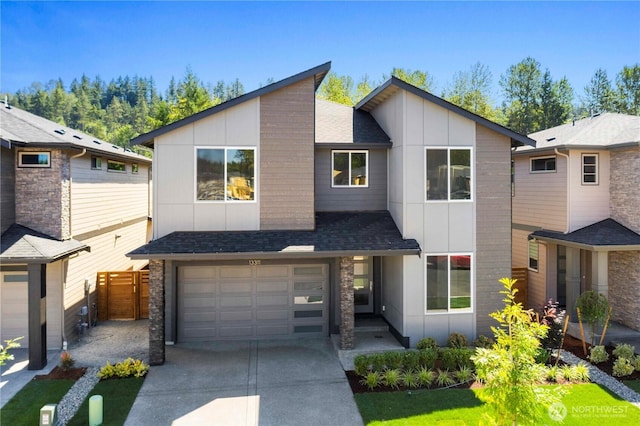 20837 156th St E, Bonney Lake, WA 98391 - contemporary home with board and batten siding, concrete driveway, an attached garage, and a shingled roof