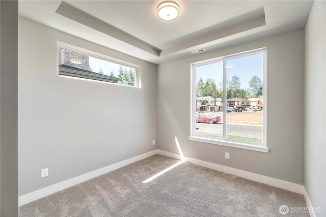 20837 156th St E, Bonney Lake, WA 98391 - carpeted empty room featuring a tray ceiling and baseboards