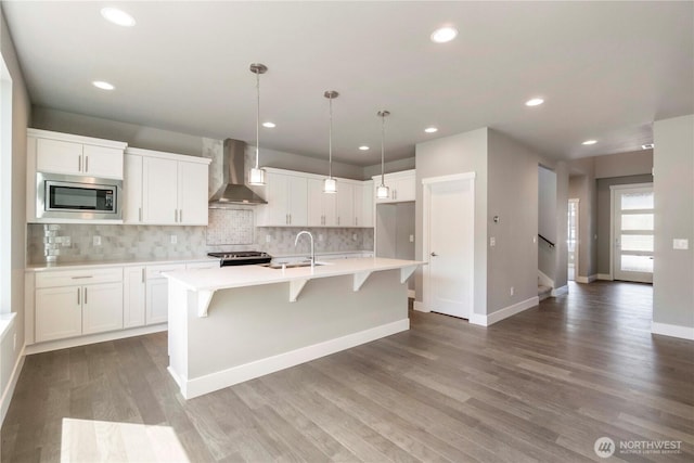 20837 156th St E, Bonney Lake, WA 98391 - kitchen with wall chimney range hood, stainless steel microwave, light countertops, white cabinets, and decorative backsplash
