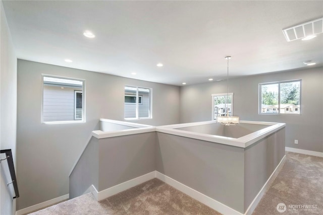 20837 156th St E, Bonney Lake, WA 98391 - kitchen with light carpet, recessed lighting, pendant lighting, and light countertops