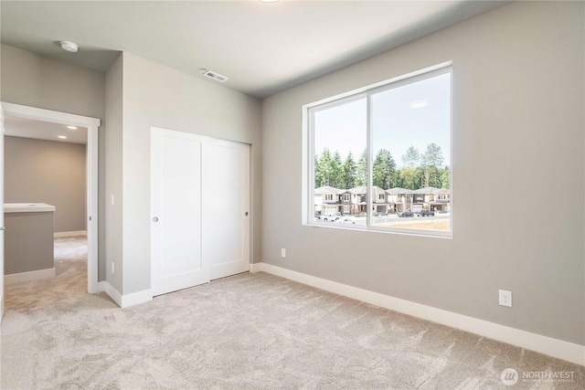 20837 156th St E, Bonney Lake, WA 98391 - unfurnished bedroom featuring carpet floors and a closet