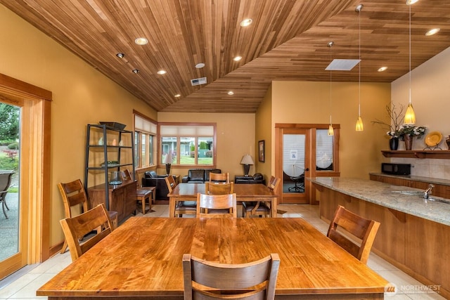 512 Darby Dr Unit 213, Bellingham, WA 98226 - dining area with wood ceiling, plenty of natural light, light tile patterned floors, vaulted ceiling, and recessed lighting