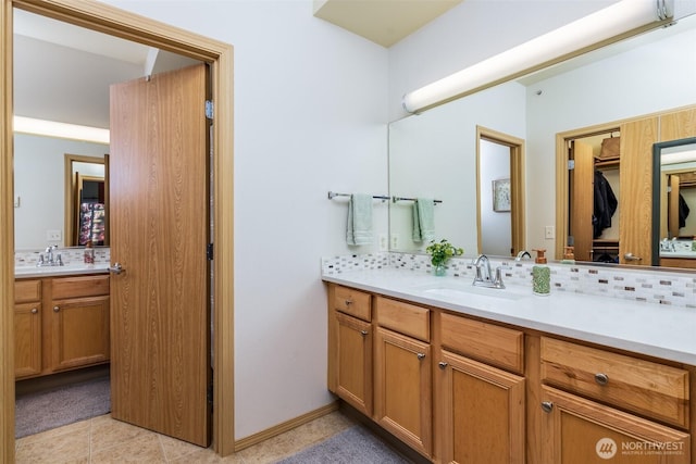 512 Darby Dr Unit 213, Bellingham, WA 98226 - bathroom with vanity, decorative backsplash, and tile patterned floors
