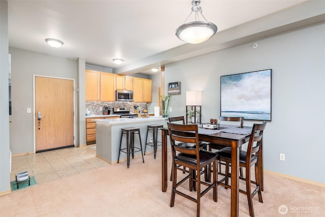 512 Darby Dr Unit 213, Bellingham, WA 98226 - dining area featuring light carpet and light tile patterned flooring