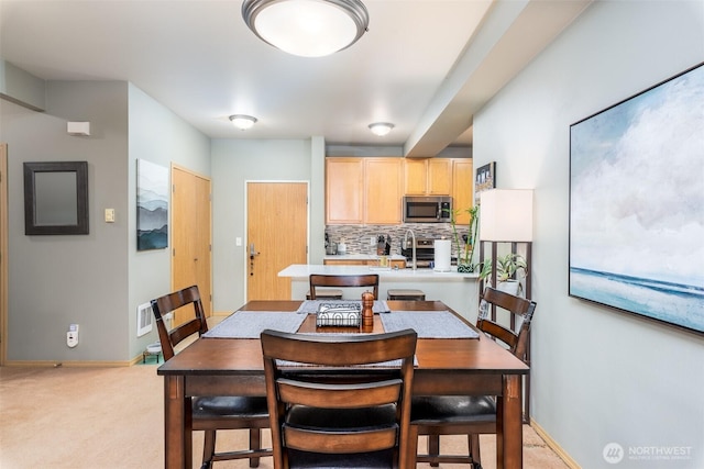 512 Darby Dr Unit 213, Bellingham, WA 98226 - dining room featuring light carpet and baseboards