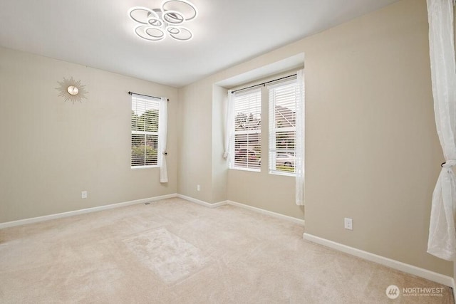 1353 32nd Pl NE, Auburn, WA 98002 - unfurnished room featuring light carpet and baseboards