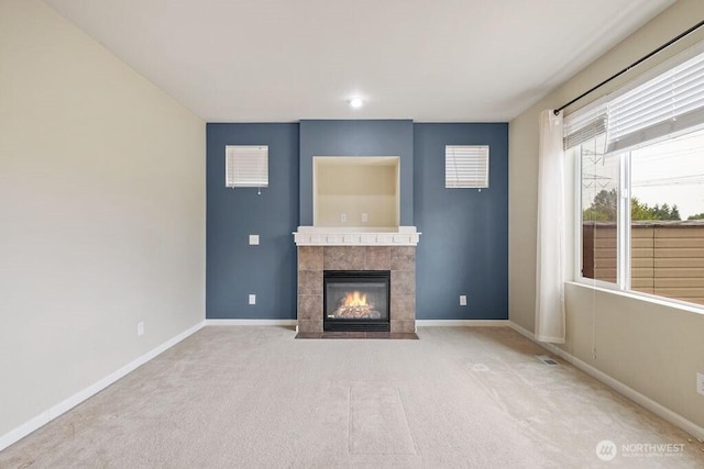 1353 32nd Pl NE, Auburn, WA 98002 - unfurnished living room featuring a tiled fireplace and carpet floors