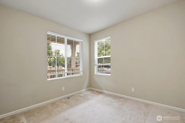 1353 32nd Pl NE, Auburn, WA 98002 - unfurnished room featuring baseboards and carpet floors