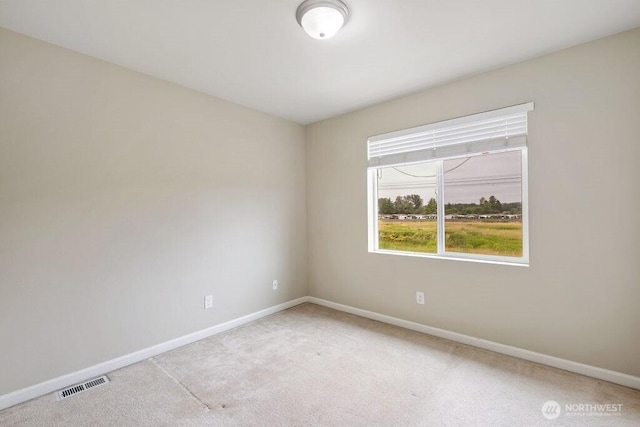 1353 32nd Pl NE, Auburn, WA 98002 - empty room with baseboards and light colored carpet
