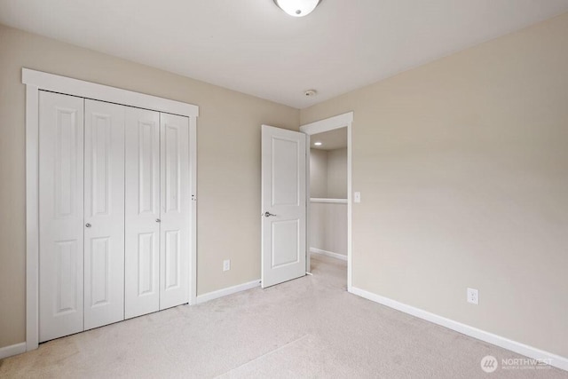 1353 32nd Pl NE, Auburn, WA 98002 - unfurnished bedroom with light carpet and a closet