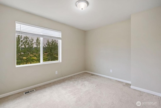 1353 32nd Pl NE, Auburn, WA 98002 - carpeted spare room featuring baseboards