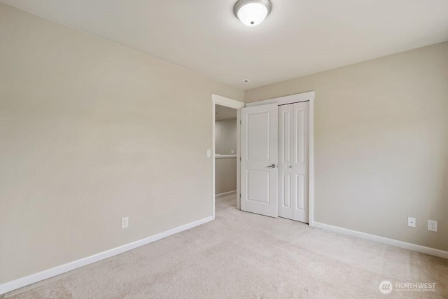 1353 32nd Pl NE, Auburn, WA 98002 - unfurnished bedroom with light carpet and a closet