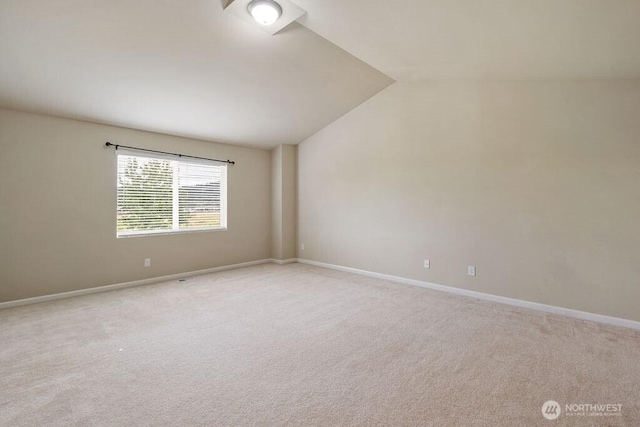 1353 32nd Pl NE, Auburn, WA 98002 - spare room featuring carpet flooring and vaulted ceiling
