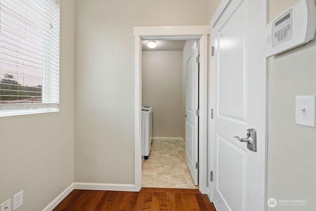 1353 32nd Pl NE, Auburn, WA 98002 - corridor with washing machine and dryer and wood finished floors