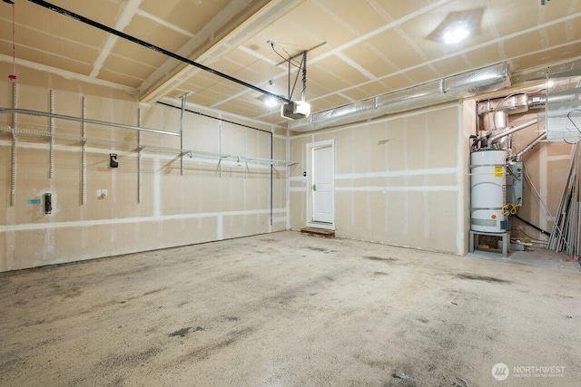 1353 32nd Pl NE, Auburn, WA 98002 - garage featuring a garage door opener and water heater