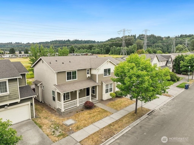 1353 32nd Pl NE, Auburn, WA 98002 - view of front of home featuring covered porch, a shingled roof, a residential view, and driveway