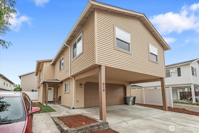 919 4th Ave N, Kent, WA 98032 - townhome / multi-family property with a garage, a carport, and concrete driveway