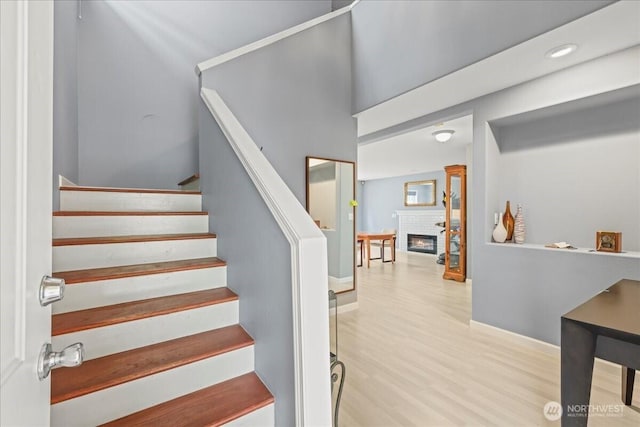 919 4th Ave N, Kent, WA 98032 - stairs featuring a fireplace, wood finished floors, and recessed lighting