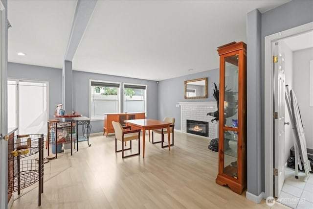 919 4th Ave N, Kent, WA 98032 - dining space with a brick fireplace and light wood finished floors