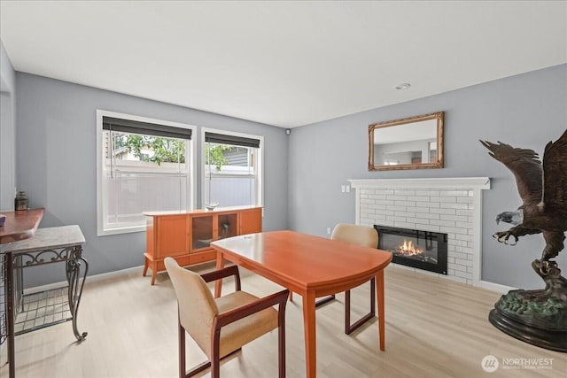 919 4th Ave N, Kent, WA 98032 - dining area with a brick fireplace and light wood-type flooring