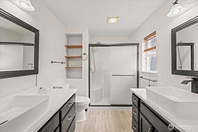 919 4th Ave N, Kent, WA 98032 - bathroom with a stall shower, vanity, and wood finished floors