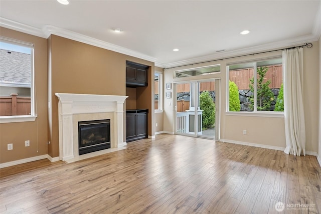 4826 Bend Dr NE, Lacey, WA 98516 - unfurnished living room with ornamental molding, a fireplace, light wood finished floors, and recessed lighting