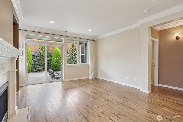 4826 Bend Dr NE, Lacey, WA 98516 - unfurnished living room with a fireplace with flush hearth, ornamental molding, light wood-type flooring, and recessed lighting
