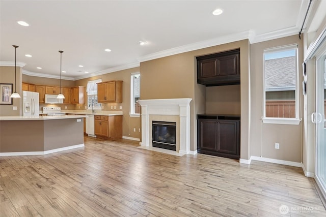 4826 Bend Dr NE, Lacey, WA 98516 - kitchen featuring white appliances, light countertops, light wood-style floors, healthy amount of natural light, and crown molding