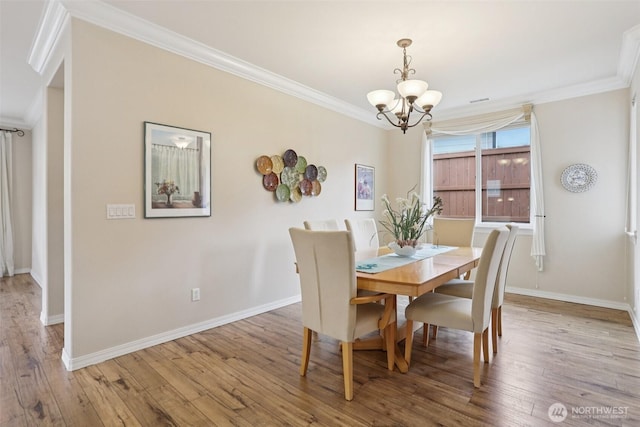 4826 Bend Dr NE, Lacey, WA 98516 - dining room featuring a chandelier, ornamental molding, and wood-type flooring