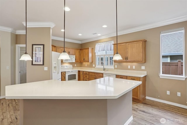 4826 Bend Dr NE, Lacey, WA 98516 - kitchen with white appliances, ornamental molding, light wood-type flooring, light countertops, and hanging light fixtures