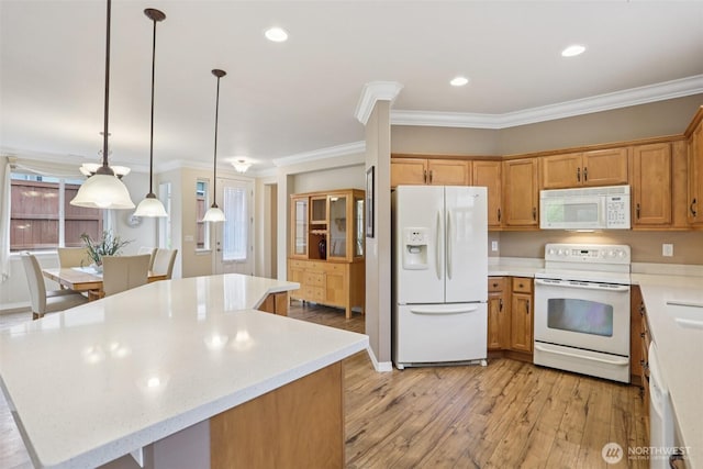 4826 Bend Dr NE, Lacey, WA 98516 - kitchen featuring white appliances, light wood-style floors, light countertops, crown molding, and a kitchen island