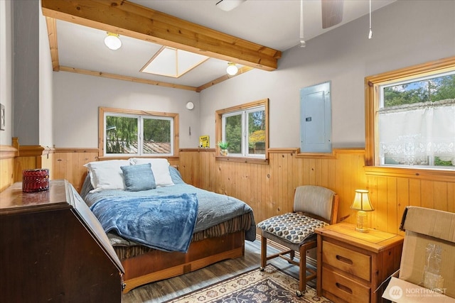 30710 223rd Ave NE, Arlington, WA 98223 - bedroom with electric panel, wainscoting, multiple windows, wood finished floors, and beamed ceiling