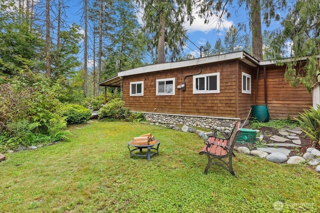 30710 223rd Ave NE, Arlington, WA 98223 - view of home's exterior with a yard and a fire pit