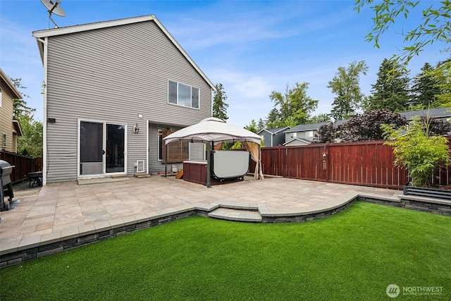 7726 162nd St E, Puyallup, WA 98375 - back of house with a gazebo, a fenced backyard, and a patio area