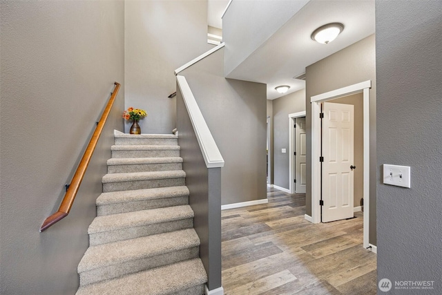 7726 162nd St E, Puyallup, WA 98375 - stairs featuring wood finished floors and a textured wall