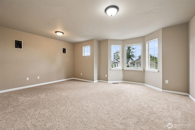 7726 162nd St E, Puyallup, WA 98375 - unfurnished room featuring baseboards and light carpet